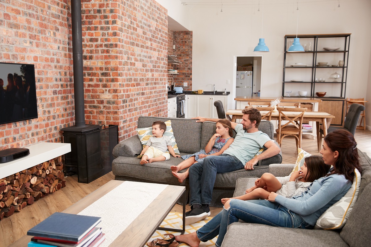 Family watching tv in the living room