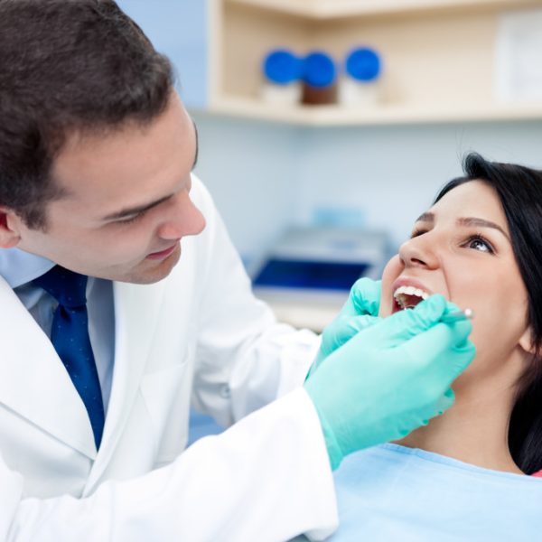 dentist checking a patients mouth